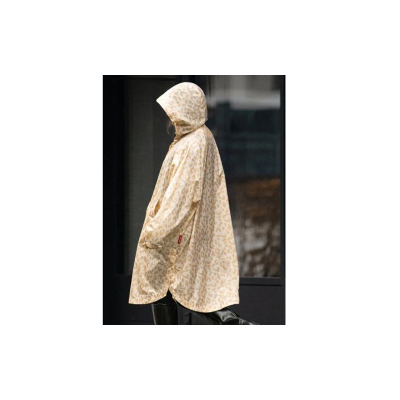 Poncho imperméable ivoire motif léopard